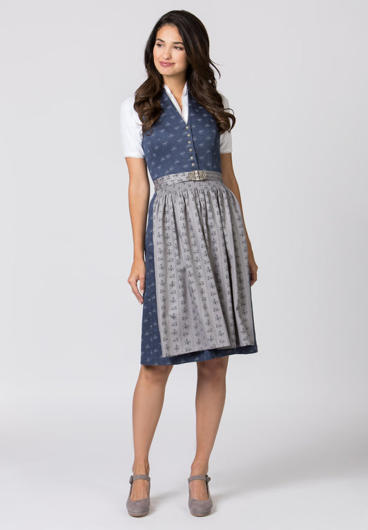 Women wearing a blue dirndl with a gray apron that has buckle on the apron.