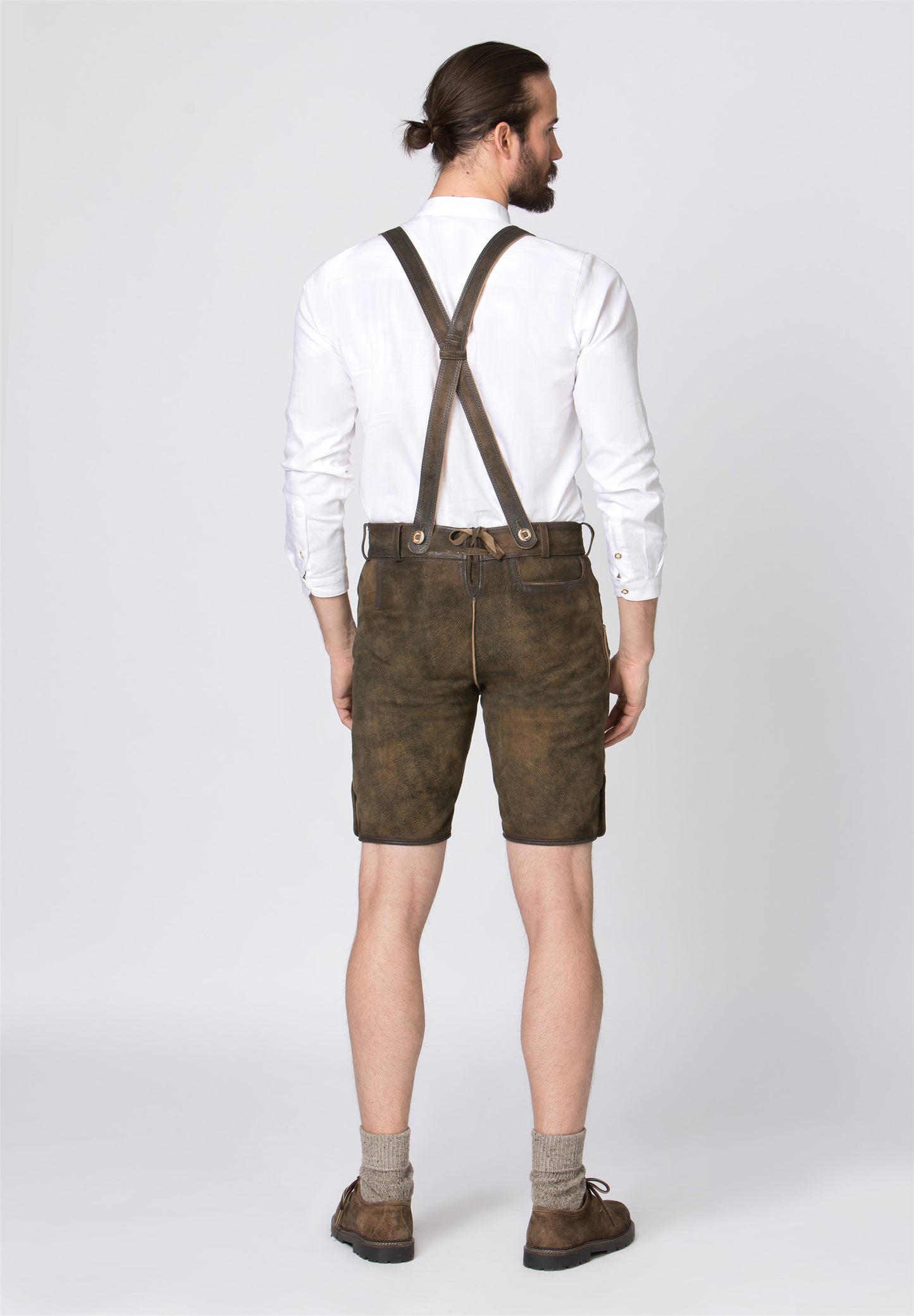 The back view of traditional lederhosen with the suspenders.