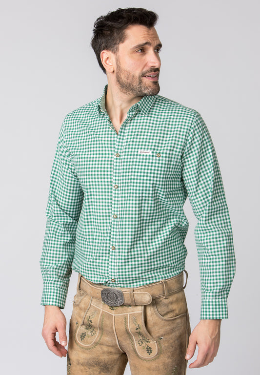 A close up of the top of a A man wearing a lederhosen and A long-sleeved, dark green and white checkered men's shirt.