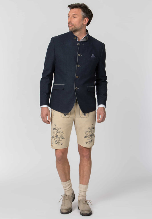 Man wearing a navy blazer, beige shorts, and brown shoes on a white background