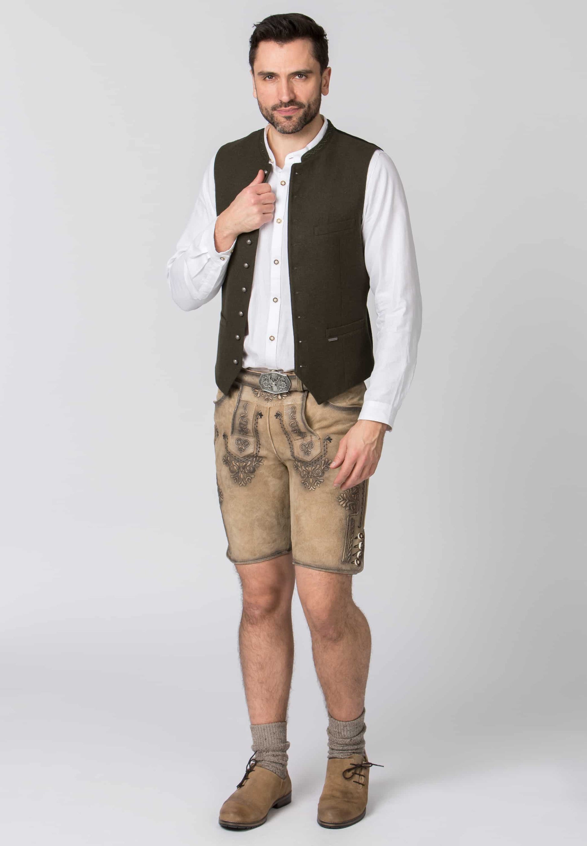 Man wearing traditional Bavarian clothing on a white background